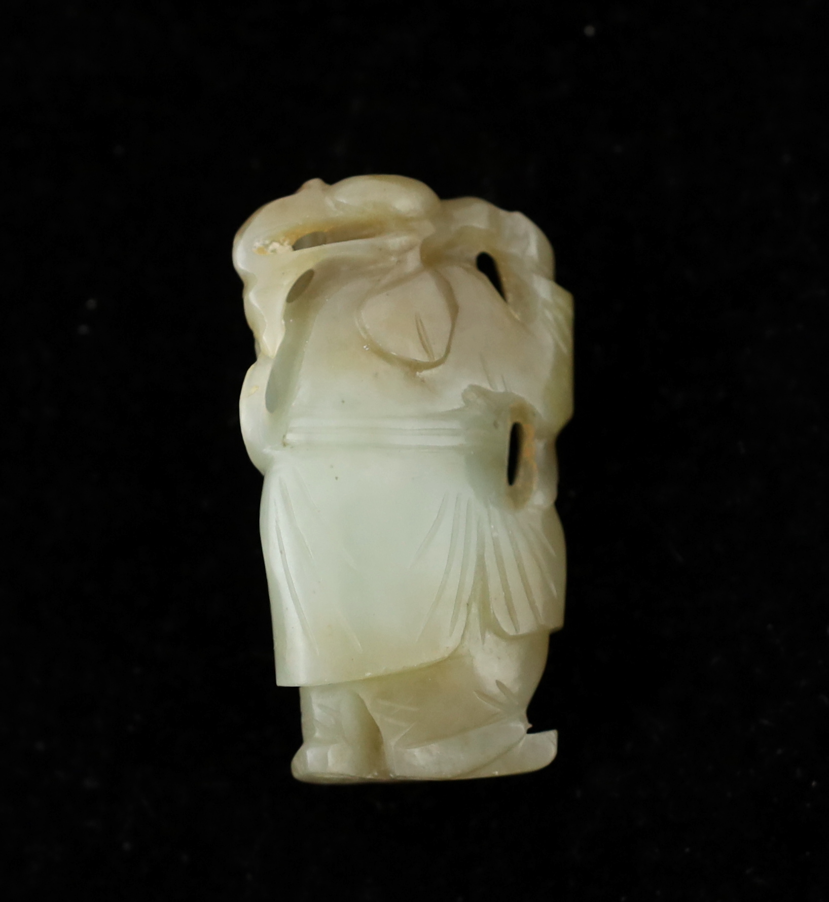 A Chinese pale celadon and russet jade figure of an old man, 18th / 19th century